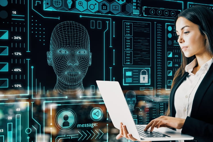 Woman looking at her laptop with a digital candidate profile in the background